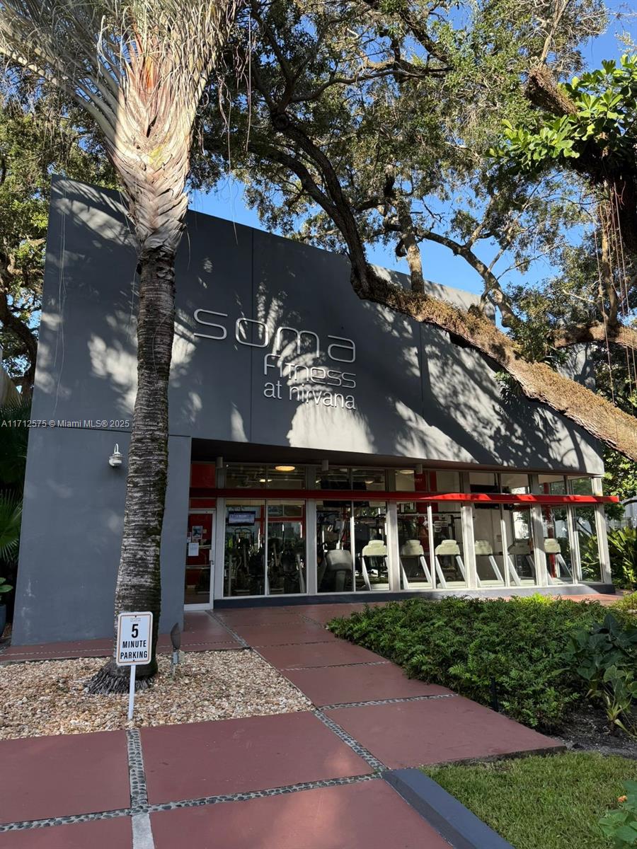 650 Northeast 64th Street, Unit G503 Miami, FL 33138 - Photo 13 of 22 front view of a house with a yard