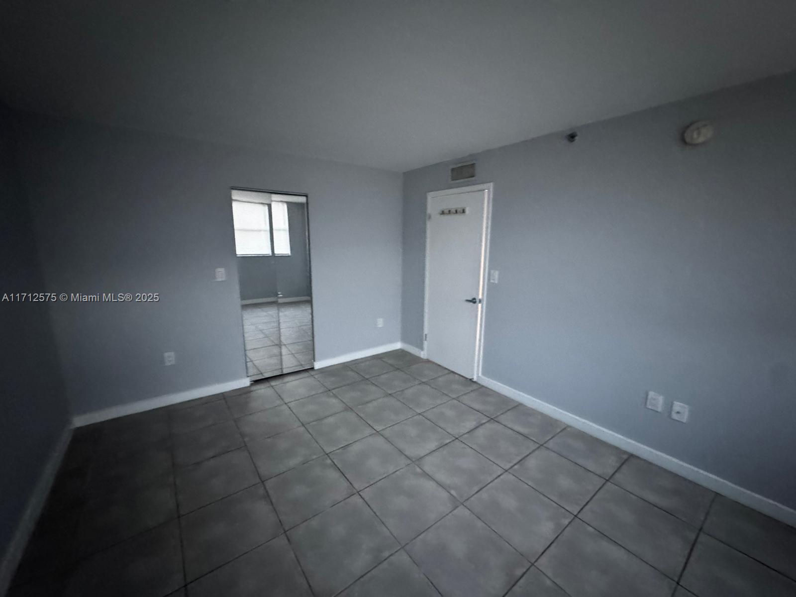 650 Northeast 64th Street, Unit G503 Miami, FL 33138 - Photo 17 of 22 a view of an empty room and window