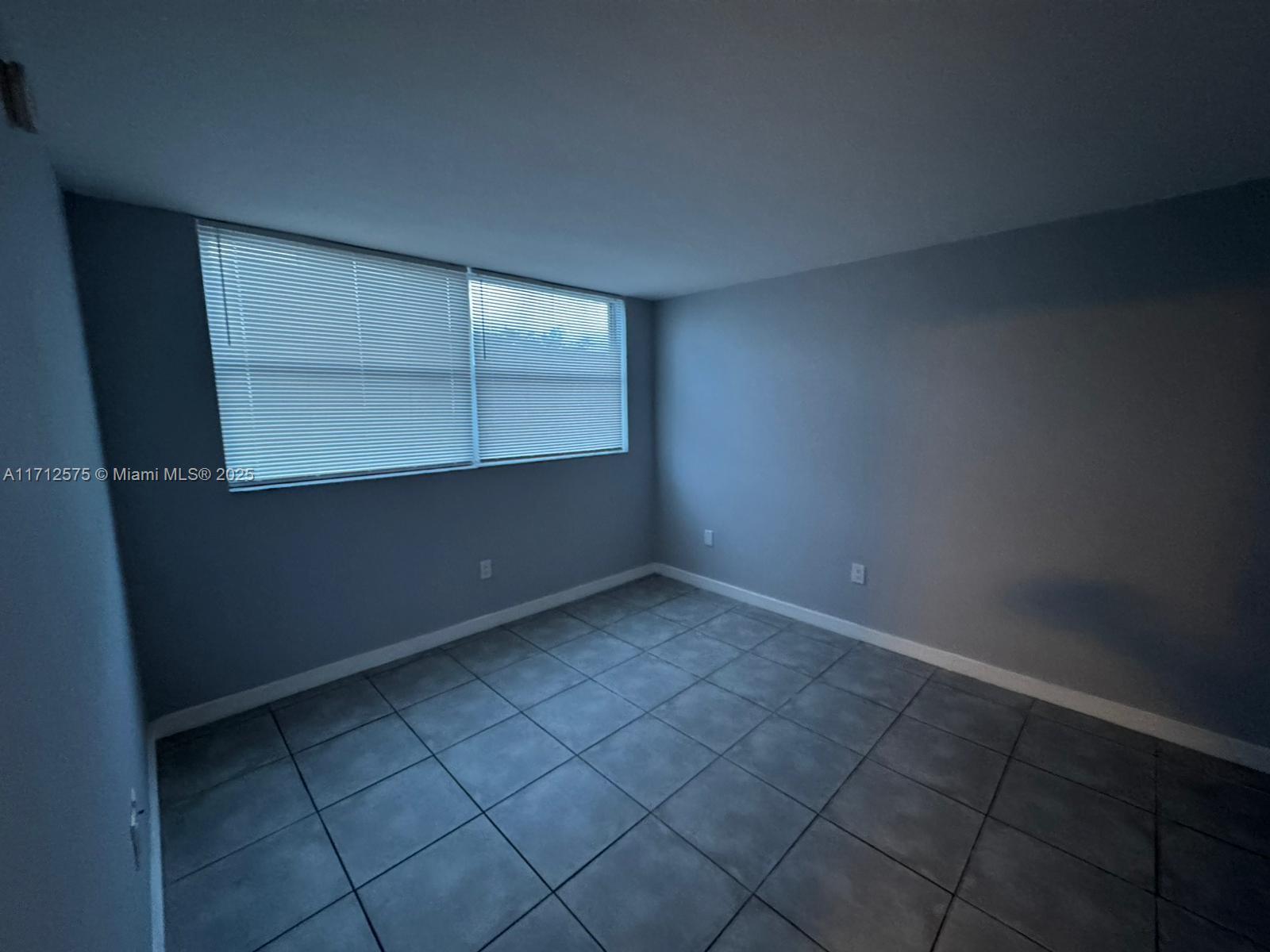650 Northeast 64th Street, Unit G503 Miami, FL 33138 - Photo 18 of 22 an empty room with cabinet