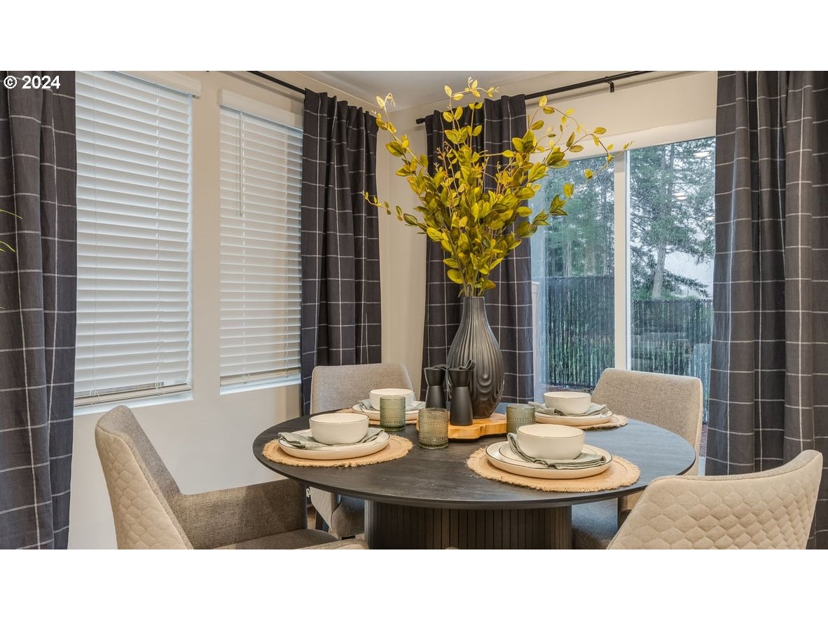 1555 Southeast Pheasant Avenue Gresham, OR 97080 - Photo 14 of 32 a dining room with furniture and wooden floor