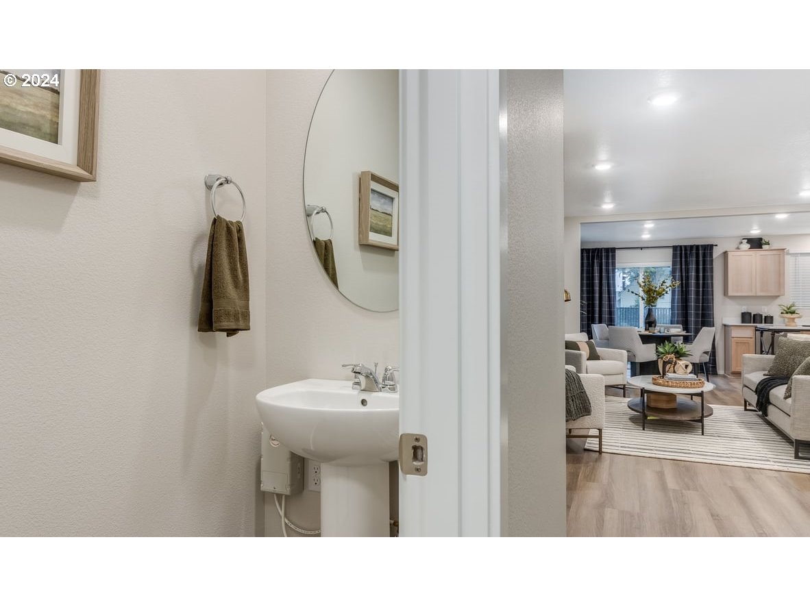 1555 Southeast Pheasant Avenue Gresham, OR 97080 - Photo 3 of 32 a bathroom with a sink and a mirror