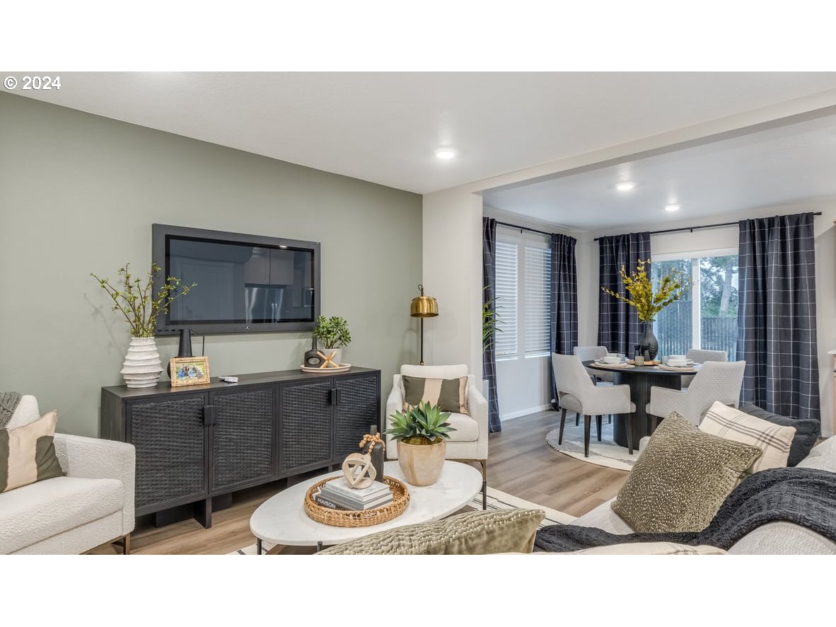 1555 Southeast Pheasant Avenue Gresham, OR 97080 - Photo 5 of 32 a living room with furniture a window and kitchen view