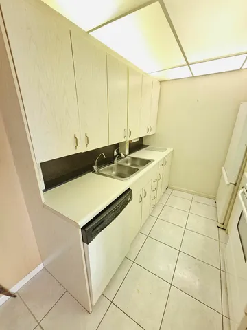 a bedroom with a bed and a night stand