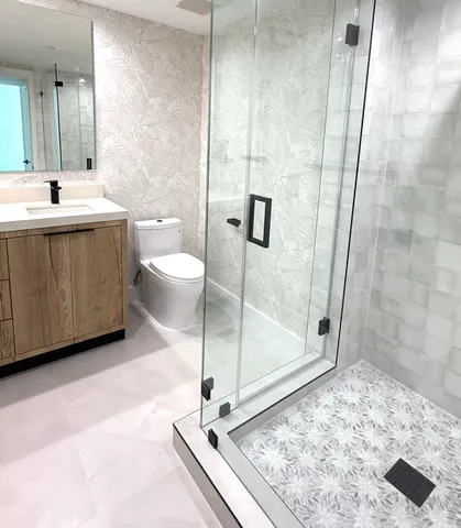 a bathroom with a shower and a sink