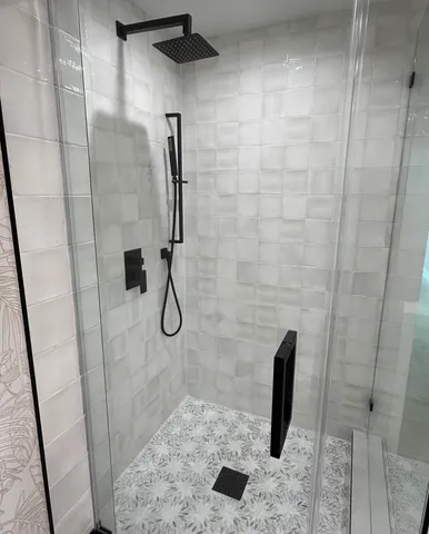 a bathroom with a sink and a shower