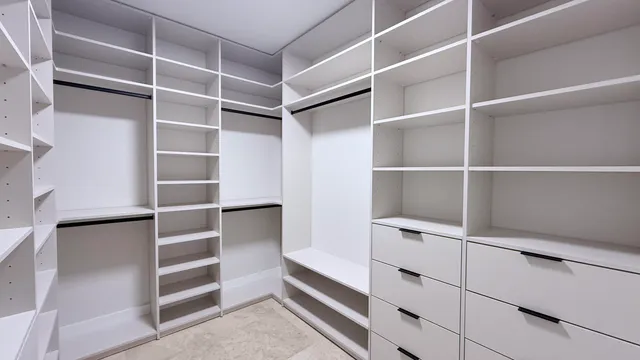 a view of an empty walk in closet