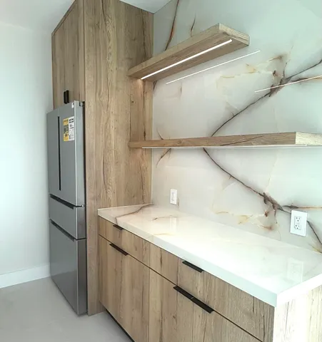 a bathroom with a sink and mirror