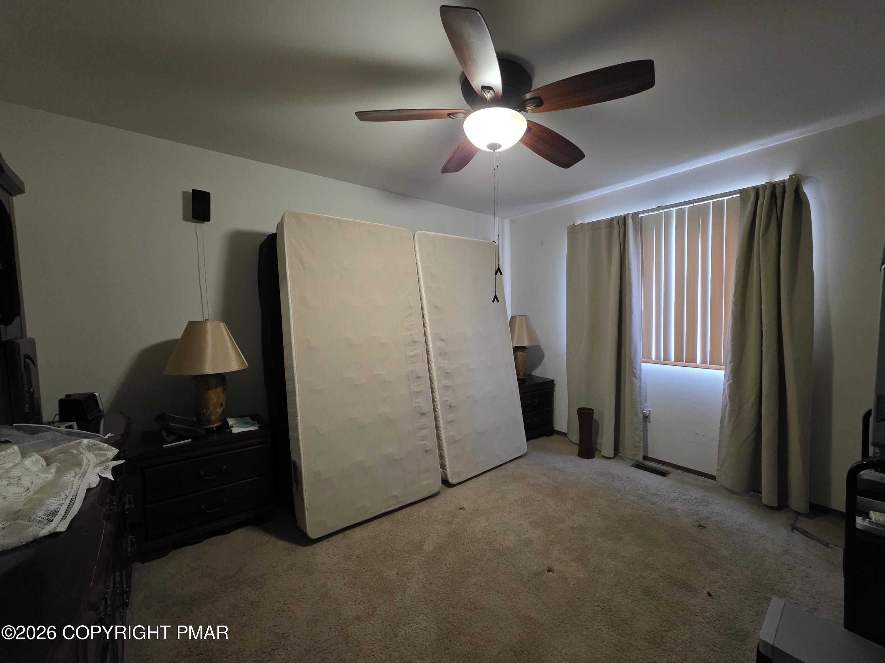 503 English Court Bushkill, PA 18324 - Photo 8 of 14 a view of a livingroom with furniture and chandelier fan