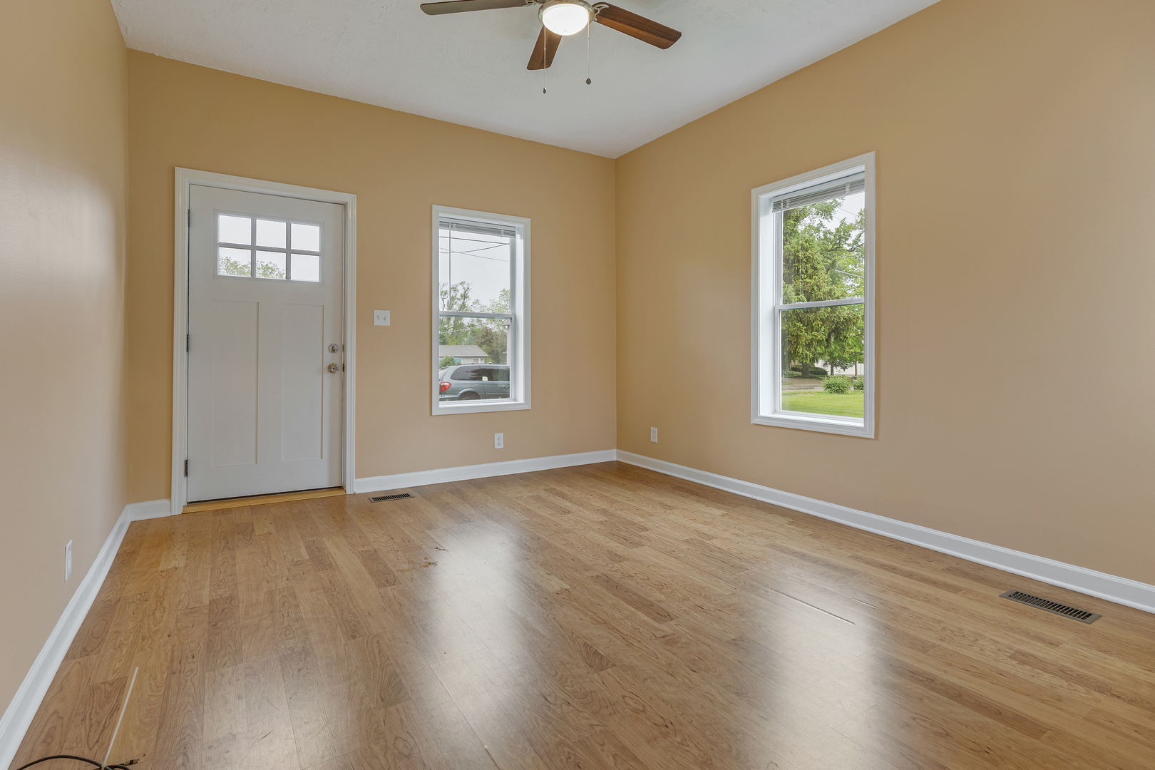 11611 Maple Avenue Hebron, IL 60034 - Photo 4 of 23 a view of an empty room with window and wooden floor