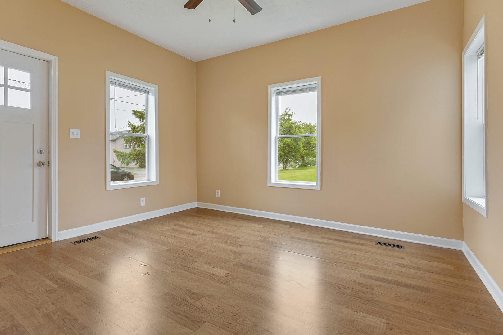 11611 Maple Avenue Hebron, IL 60034 - Photo 5 of 23 a view of an empty room with wooden floor and a window