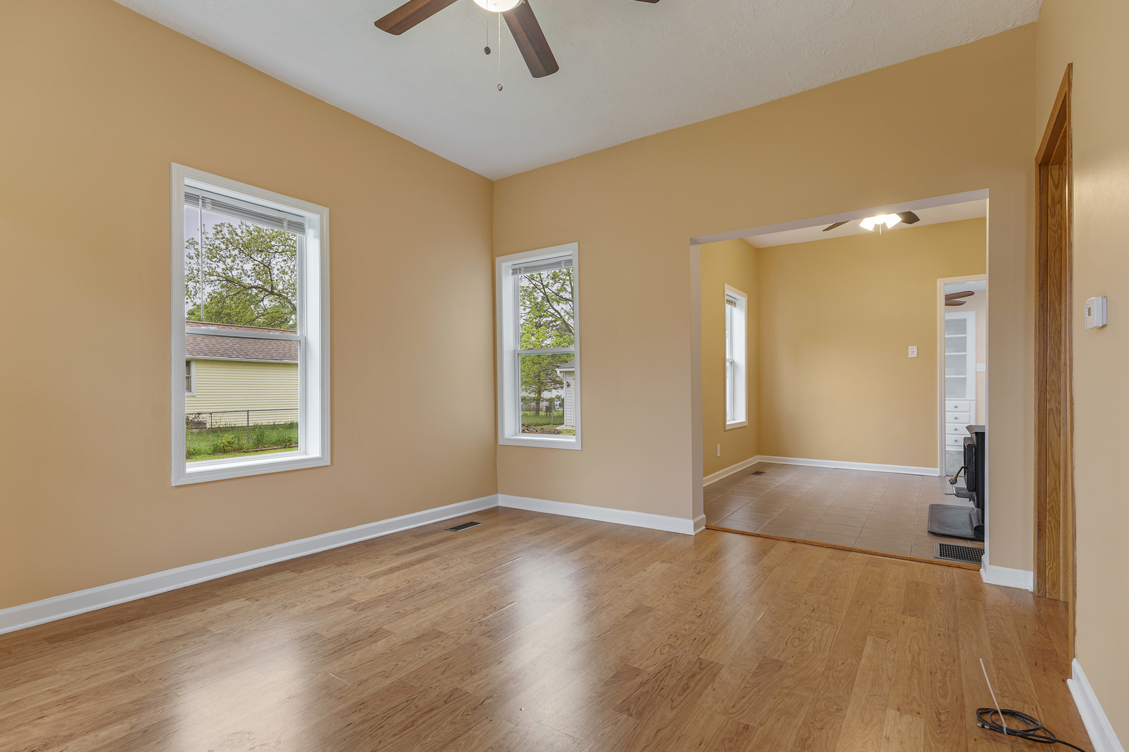 11611 Maple Avenue Hebron, IL 60034 - Photo 6 of 23 a view of livingroom with hardwood floor and ceiling fan