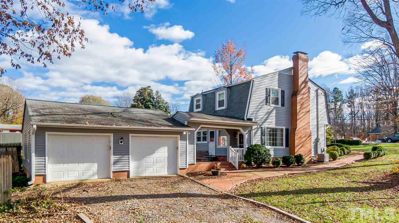 664 Semora Road Roxboro, NC 27573 - Photo 2 of 13 a front view of a house with a yard