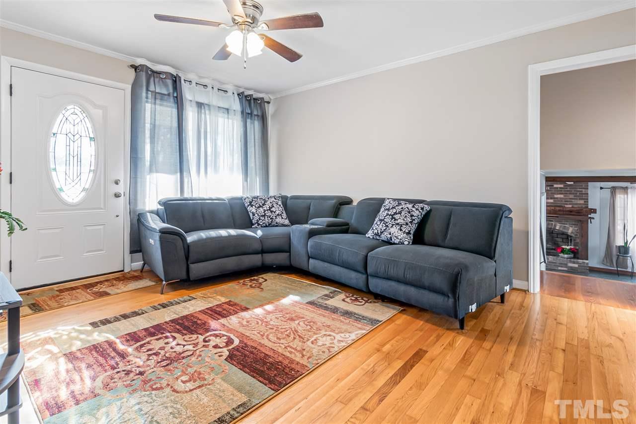 664 Semora Road Roxboro, NC 27573 - Photo 6 of 13 a living room with furniture and a rug