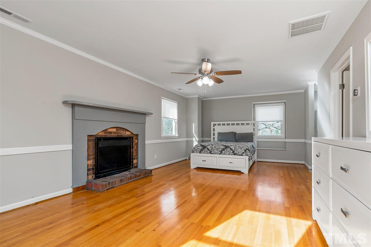 664 Semora Road Roxboro, NC 27573 - Photo 8 of 13 a living room with furniture and a fireplace