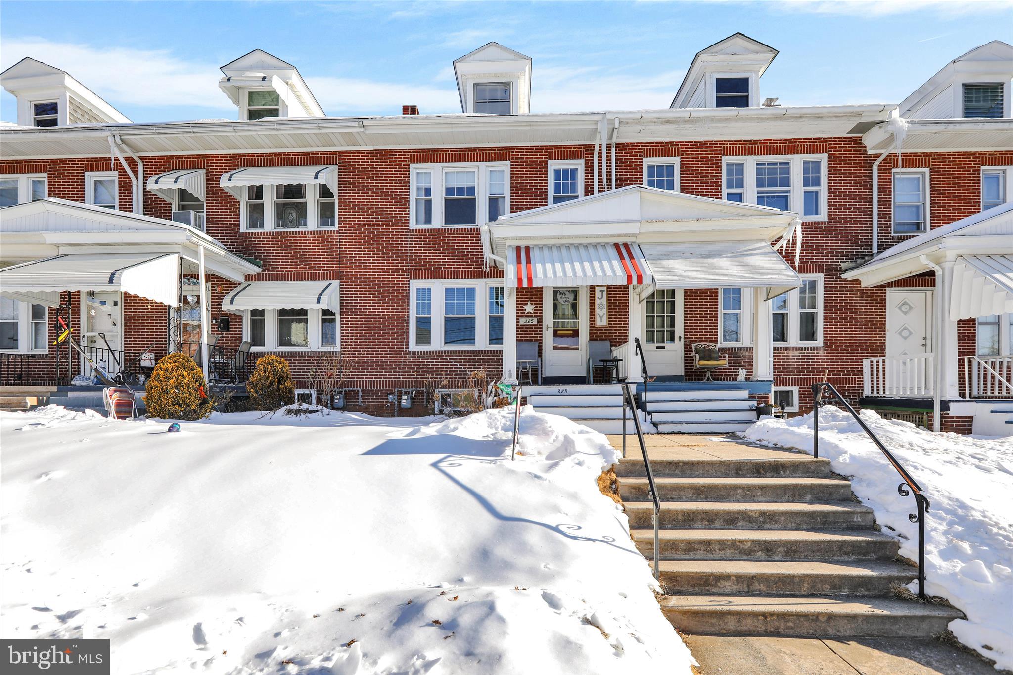 a front view of a building with street view