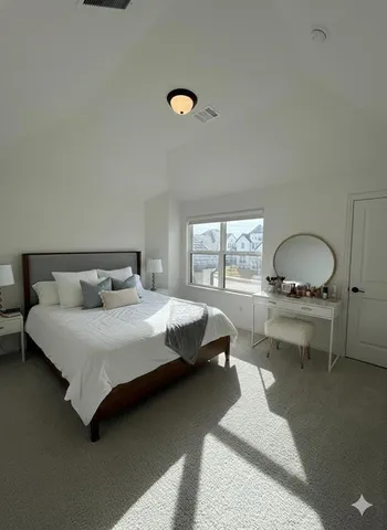 a bedroom with a bed and window