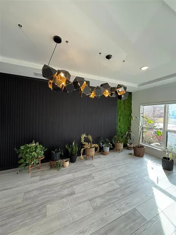 a view of a room with furniture and a ceiling fan