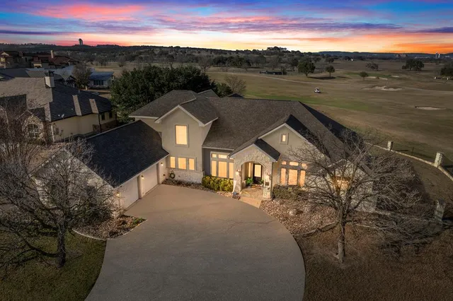 a view of a town with mountains in the background