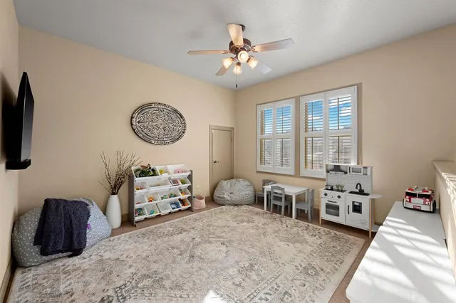 a bedroom with furniture and a large mirror