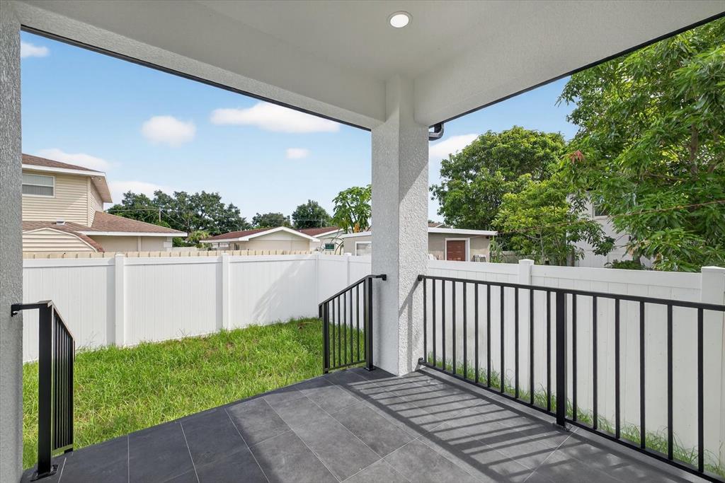 2719 West St John Street Tampa, FL 33607 - Photo 41 of 44 a view of a pathway of a building with a yard