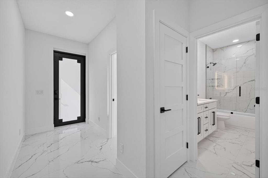 2719 West St John Street Tampa, FL 33607 - Photo 9 of 44 a bathroom with a double vanity sink and a mirror