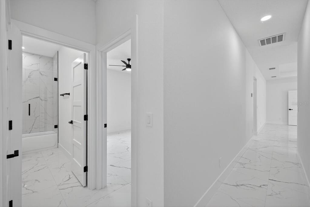 2719 West St John Street Tampa, FL 33607 - Photo 10 of 44 a view of a bathroom with shower