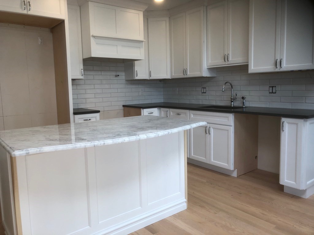 43 Addington Road, Unit 3 Brookline, MA 02445 - Photo 15 of 24 a kitchen with stainless steel appliances granite countertop a sink and a granite counter tops