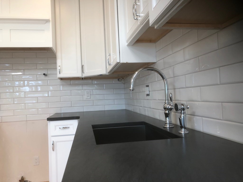 43 Addington Road, Unit 3 Brookline, MA 02445 - Photo 17 of 24 a kitchen with a sink and cabinets