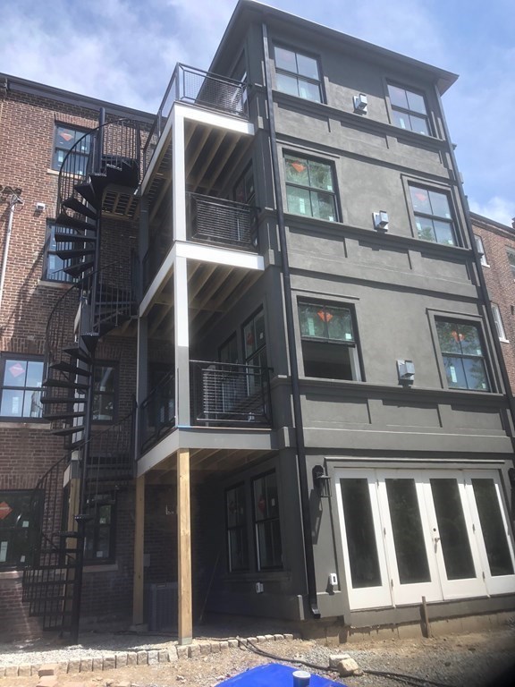 43 Addington Road, Unit 3 Brookline, MA 02445 - Photo 5 of 24 a view of a building with a door