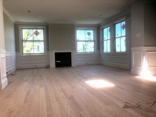 43 Addington Road, Unit 3 Brookline, MA 02445 - Photo 8 of 24 an empty room with windows and a dresser