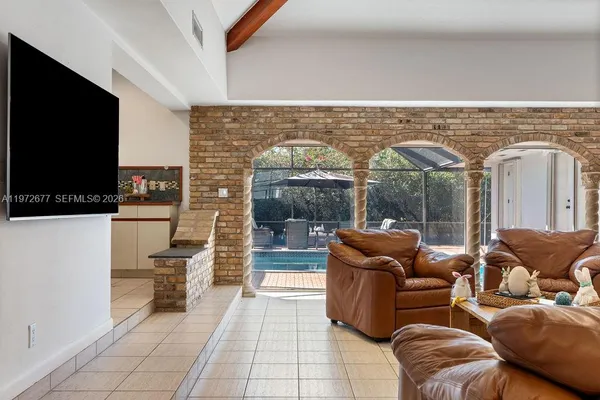 a bathroom with a sink a toilet a mirror and shower