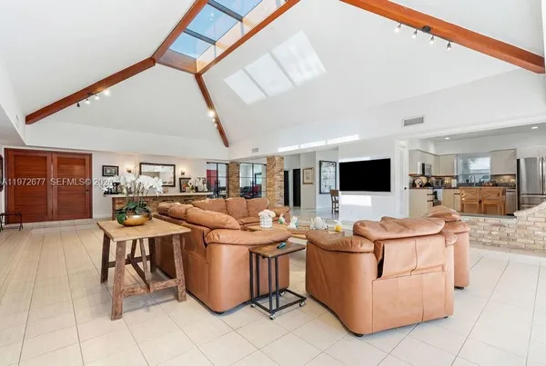 an aerial view of a house with big yard