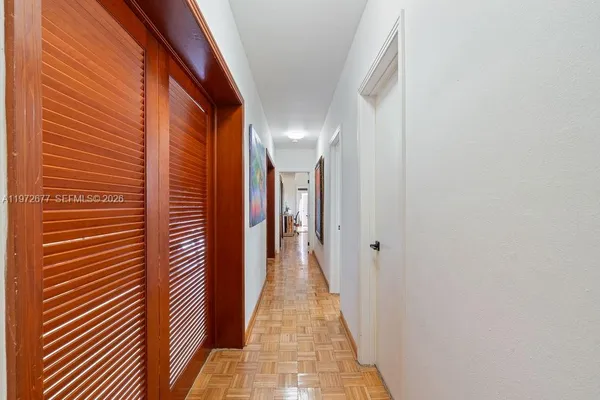 an aerial view of residential houses with city view