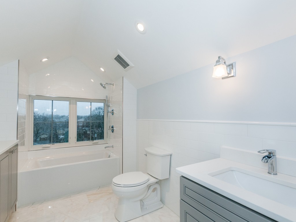 59 Bradford Road, Unit 2 Watertown, MA 02472 - Photo 13 of 20 a bathroom with a sink a toilet and shower