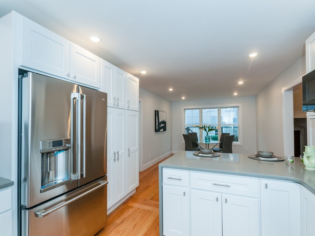59 Bradford Road, Unit 2 Watertown, MA 02472 - Photo 7 of 20 a kitchen with stainless steel appliances a refrigerator and a sink