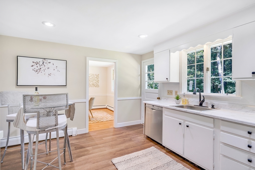 310 Hayward Mill Road Concord, MA 01742 - Photo 12 of 39 a kitchen with a sink cabinets and window
