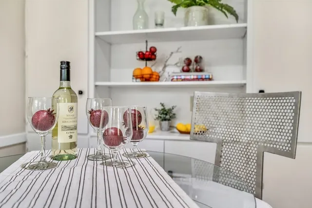 a bathroom with a sink mirror and toilet