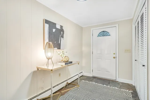 a view of a bedroom with bed and hallway