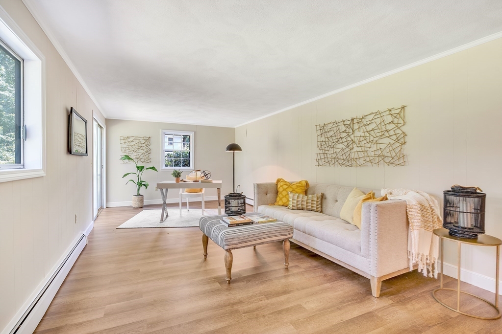 310 Hayward Mill Road Concord, MA 01742 - Photo 19 of 39 a living room with furniture and a wooden floor