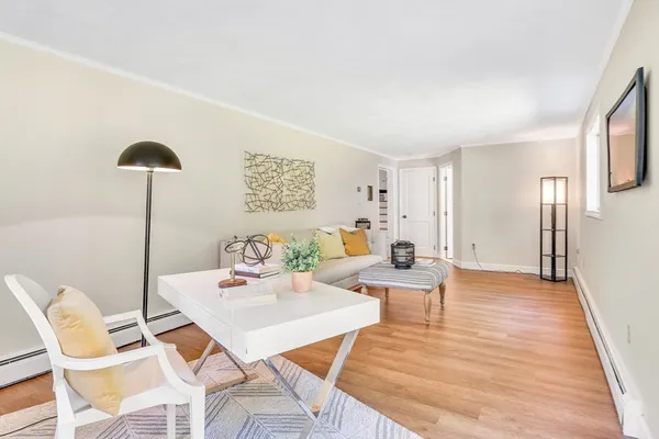 a view of a livingroom with furniture and a table