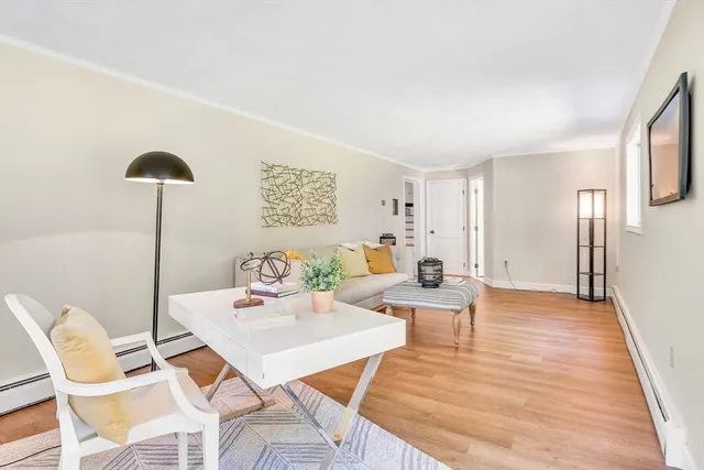 a view of a livingroom with furniture and a table