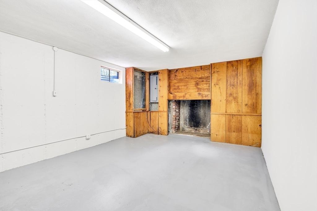 310 Hayward Mill Road Concord, MA 01742 - Photo 33 of 39 a view of empty room with a fireplace