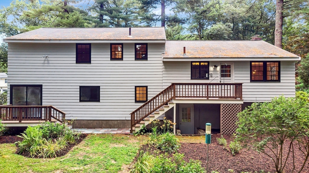 310 Hayward Mill Road Concord, MA 01742 - Photo 38 of 39 a front view of a house with garden