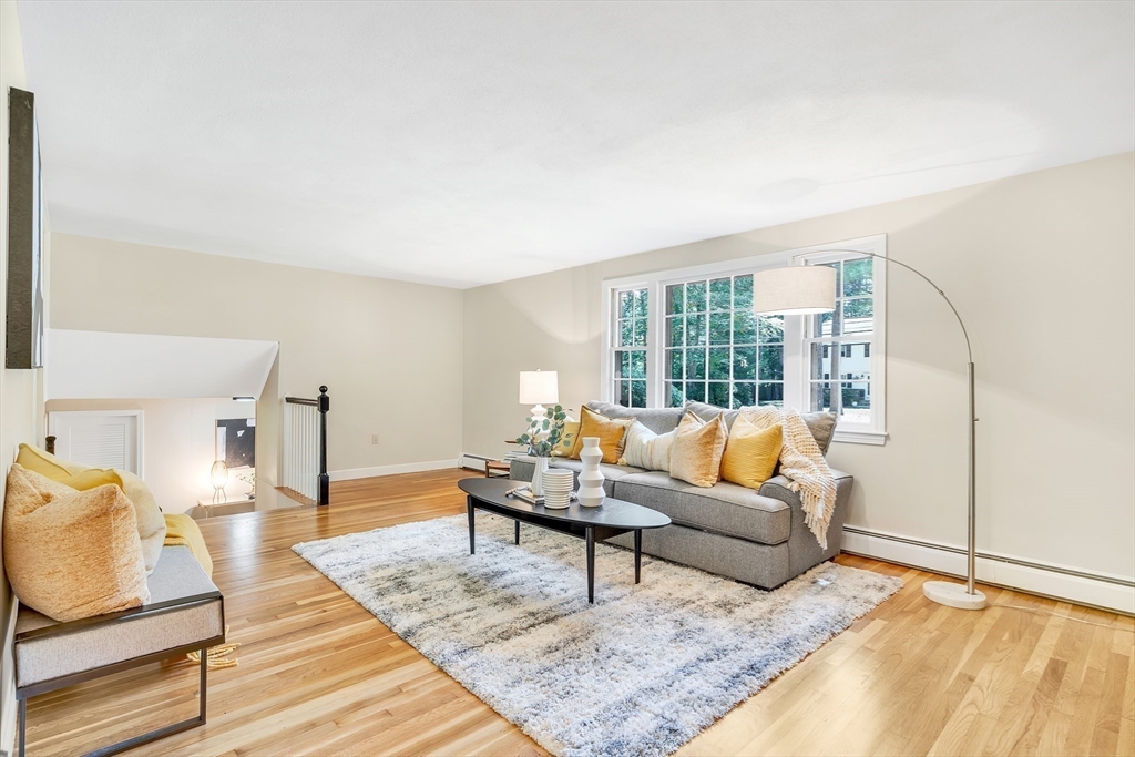 310 Hayward Mill Road Concord, MA 01742 - Photo 5 of 39 a living room with furniture and a large window