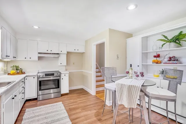 a view of kitchen with cabinets and wooden floor
