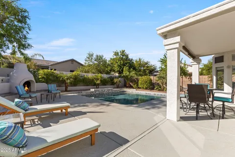 a view of a patio with a table and chairs