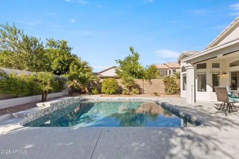a view of a backyard of the house