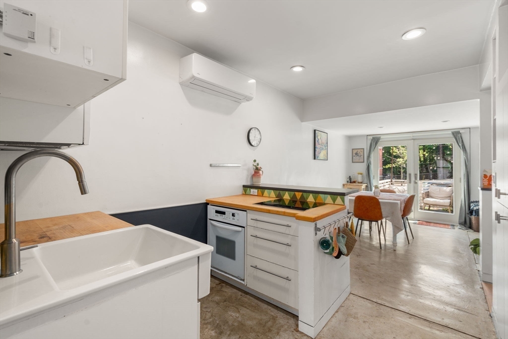 67 Dudley Street, Unit SF Boston, MA 02119 - Photo 8 of 28 a kitchen that has a sink and a stove in it