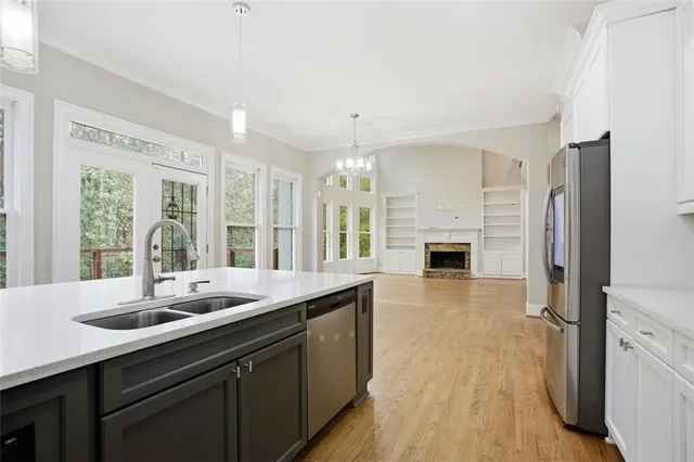 a kitchen with sink cabinets and refrigerator