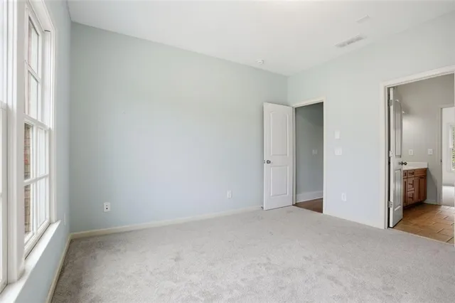 a view of an empty room and a window